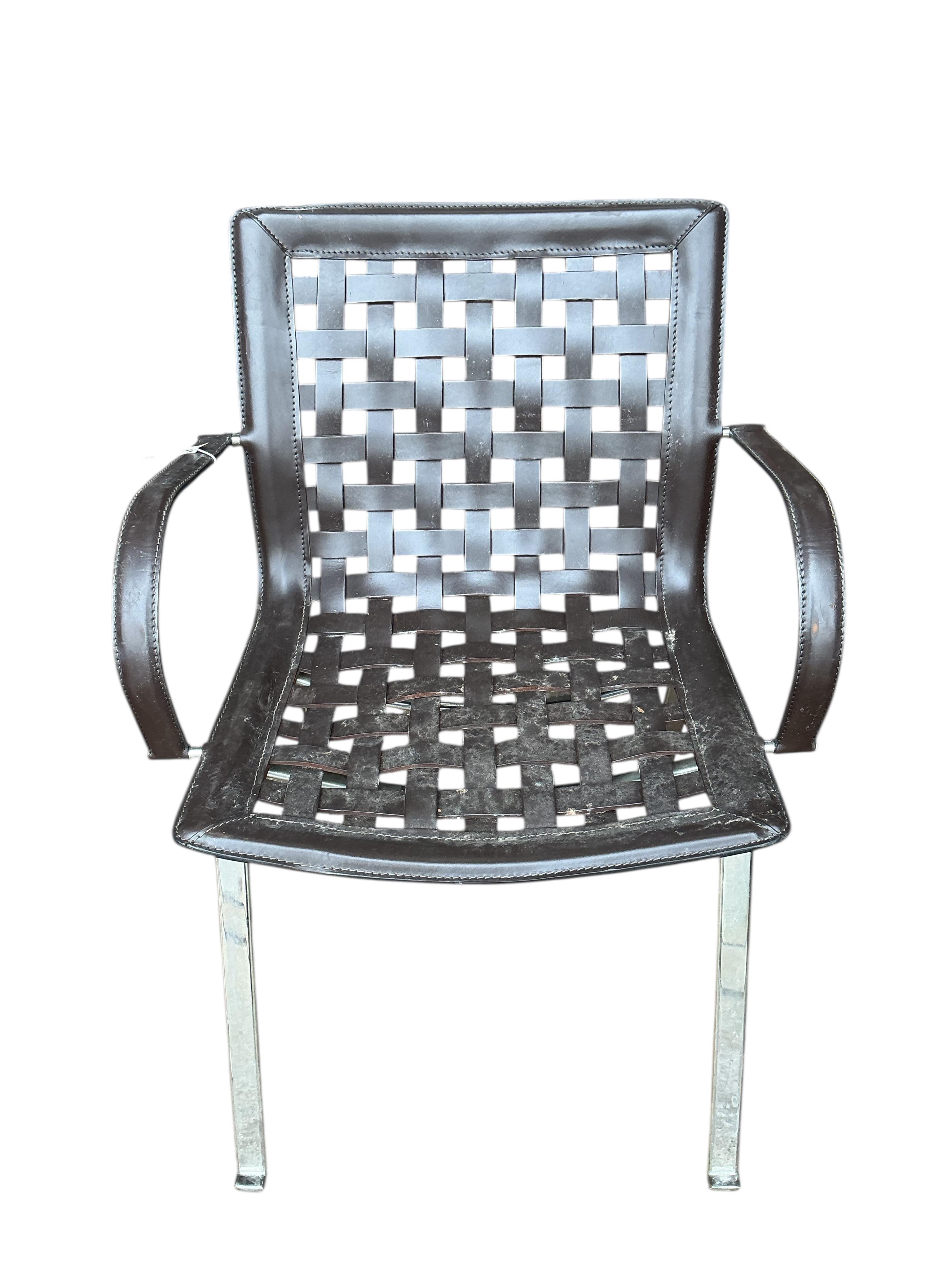 In the manner of Gancarlo for Faselhh: A set of four chrome and brown leather elbow chairs, width 62cm, depth 54cm, height 82cm